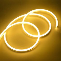 three circular lights are lit up on a yellow surface with the light turned off and glowing