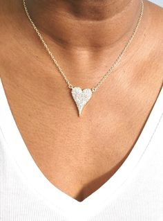 Do you want to feel the sparkle and joy of love? Look no further than the Amara Heart Diamond necklace – your new favorite piece of jewelry! This brilliant necklace features a heart-shaped cubic zirconia with a gorgeous shiny finish. The diamond-like beauty of this necklace is sure to make heads turn! Plus, its rhodium-plated or gold-plated 16" plain chain with a 2" extender provides flexibility should you want to layer it with other necklaces. Experience its beautiful sparkles for yourself and Bling Cubic Zirconia Necklaces For Valentine's Day, Heart Cut Cubic Zirconia Party Necklace, Valentine's Day Bling Cubic Zirconia Necklaces, Valentine's Day Crystal Heart Charm Necklace, Diamond Heart Pendant Jewelry For Party, Heart Pendant Diamond Jewelry For Party, Diamond Heart Pendant For Party, Valentine's Day Party Heart Necklace In Cubic Zirconia, Cubic Zirconia Rhinestone Necklace For Valentine's Day