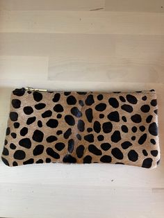 "This  Handmade Leopard Print Leather Makeup Bag with Black Cotton Lining the perfect birthday gift, graduation gift, or Christmas gift for all women. All our leather pouches are made with the highest quality material.  Size:  8 1/2\" x 4 1/2\" Satisfaction Guarantee: We strive to provide elite customer service and satisfaction to our customers! If for any reason you are unhappy with your purchase, please let us know and we will work with you to resolve any issues that you are having. Questions? Trendy Brown Pouch For Gift, Trendy Portable Pouch For Gifts, Trendy Brown Pouch As A Gift, Trendy Portable Pouch For Gift, Chic Brown Pouch Cosmetic Bag, Trendy Brown Clutch Pouch, Trendy Brown Clutch For Travel, Chic Brown Cosmetic Pouch, Trendy Brown Zipper Pouch