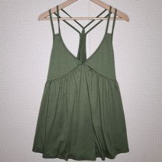 Green Strappy Racerback Flowy Tank New Without Tags. No Brand. Size: Xl Spring Tank Top With Crisscross Strappy Back, Trendy Strappy Back Tops For Summer, Beach Cami Top With Crisscross Straps, Sleeveless Tops With Crisscross Straps For Vacation, Summer Stretch Tank Top With Cross Back, Summer Stretch Cross-back Tank Top, Summer Racerback Tops For Day Out, Chic Cross Back Tank Top For Summer, Summer Sleeveless Top With Crisscross Straps