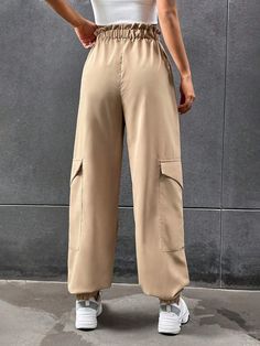 Stay comfortable and stylish with these Elastic Knot Detail Pants with Pocket. These pants feature an elastic waistband with a knot detail, adding a trendy and chic element to the design. The pocket provides functional storage space while enhancing the overall style. Whether you pair them with a casual tee or a flowy blouse, these elastic knot detail pants with pocket will give you a fashionable and effortless look. Specifications: Style: Casual Type: Cargo Pants Details: Knot, Pocket, Paperbag Pants Details, Flowy Blouse, Functional Storage, Casual Tee, Cargo Pants, Elastic, Overalls, Storage Spaces, Pants