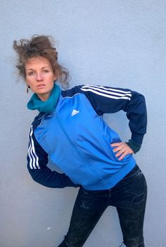 "Blue ADIDAS workout jacket, neon tracksuit, bomber jacket, outdoor windbreaker, running jacket, S/M Warm and comfortable ADIDAS neon tracksuit. It has two side pockets (with zipper) and zipper closure. Size: showed L (USA), seems like women (M) and men (S) PLEASE CHECK ALL MEASUREMENTS BELLOW: Length: 60 cm/ 24\" Shoulder to shoulder: 42 cm/ 17\" Sleeves: 63 cm/ 25'' Chest: 106 cm/ 42\" Brand: ADIDAS Condition: excellent Fabric: polyester Model wears: UK 8/ EU 36/ US 4 Model's height: 175 cm/5' Luxury Blue Winter Track Jacket, Stretch Casual Training Outerwear, Nylon Sportswear Track Jacket For Training, Nylon Track Jacket For Training, Sports Track Jacket With Ribbed Cuffs, Sporty Track Jacket For Winter Sports, Sporty Track Jacket With Ribbed Cuffs For Workout, Winter Gym Tracksuit, Winter Tracksuit For Gym