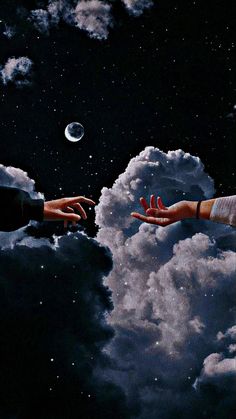 two hands reaching out to each other in the sky with clouds and moon behind them