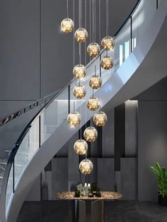 a modern chandelier hanging from the ceiling