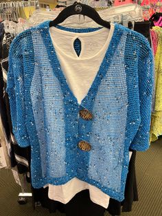 Vibrant Blue with black and white speckle color Mid-length sleeve 2 Over-Size Buttons Perfect cardigan for many dresses or tank tops Size Recommendation: Size down 1 size in this cardigan Sizing Size Dress Size Bust Waist Hips XS 4 34"-35" 26"-27" 37"-38" S 6-8 36"-37" 28"-29" 39"-40" M 8-10 38"-39" 30"-31" 41"-42" L 12-14 40"-41" 32"-33" 43"-44" XL 16 42"-43" 34"-35" 45"-46" 1X 18 44"-45" 36"-37" 47"-48" Lulu-B Clothing was started from a small family business that was founded in 1977 in South Casual Blue V-neck Cardigan, Blue V-neck Top, Blue V-neck Sweater For Summer, Blue V-neck Summer Sweater, V-neck Blue Cardigan For Beach, Blue Summer Sweater For Beach, Blue One Size V-neck Top, One Size Blue Trendy Cardigan, Blue V-neck Top One Size