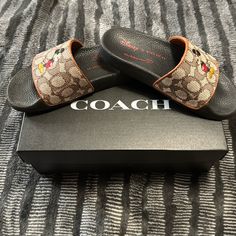 High Quality Coach Brand Slides, Never Been Use, Size 5 For Women Also Fits With The Kids, Cocoa Color, Original And With The Original Box. Coach Slides With Branded Insole And Round Toe, Coach Synthetic Round Toe Slides, Coach Open Toe Slides With Removable Insole, Coach Summer Slip-on Slides, Coach Brown Open Toe Sandals, Coach Slides, Coach Shoes, Brand Colors, The Kids