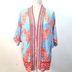 Anthropologie Bl-Nk Persephone Kimono Color Blue Orange Multi Womens One Size Open Front Short Kimono Sleeve Orange Floral Print On Blue Background Detail With Multi Color Thread Along Trim Relaxed Fit Boho Bohemien Style 100% Viscose Light Weight Fabric Dry Clean Imported Approximate Measurement Flat Lay Pit To Pit 24" But Flexible Bc Open Front Length 28" New With Tag No Noted Flaws Super Cute Msrp $108 Beach Boho Bohemien Contemporary Traditional Casual Festival Vacation Spring Summer Floral Blue V-neck Kimono For Spring, Blue V-neck Top, Blue Bohemian Top With Kimono Sleeves, Blue Tops With Kimono Sleeves, Blue Tops With Kimono Sleeves For Vacation, Blue One Size V-neck Top, Blue V-neck Top One Size, Blue Kimono For Spring Day Out, Blue Spring Day-out Kimono