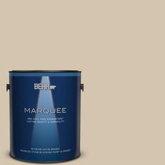 the behr marquee paint in teal is shown on a blue background