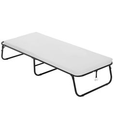 a white cot with black legs on a white background