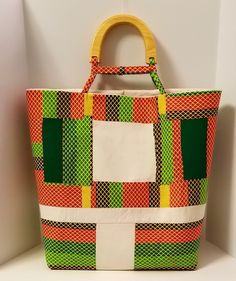 "Kente Cloth Bag | 100% Cotton Bag | Oversized Handbag | Boho Bag | Handcrafted Block Bag | Weekend Bag | Handmade | Block Fabric Bag | Gift Bright and Bold describes this boho oversize bag. This patchwork design large tote is perfect for any occasion. Custom designed handles set the tone along with two large inner pockets. Traditional African 100% cotton has a new look. Excited to introduce you all to my new \"Oversize Bag Collection. Handmade in a SMOKE-FREE and PET-FREE home. Proud to say it Handwoven Square Bucket Bag For Daily Use, Multicolor Box Bag For Daily Use, Rectangular Beach Bag With Handles For Shopping, Shopping Rectangular Beach Bag, Handwoven Top Handle Bags For Everyday Use, Handwoven Top Handle Hobo Bag For Daily Use, Multicolor Large Capacity Box Bag For Everyday, Everyday Multicolor Box Bag With Large Capacity, Natural Top Handle Bag For Market