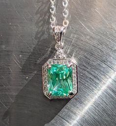 "stones were examined by a certified gemologist. Elevate Your Style with Our 9x7mm Sea Foam Green Spinel Pendant and Halo Experience the allure of natural beauty with our captivating 9x7mm Sea Foam Green Spinel Pendant, elegantly accented by a mesmerizing halo design. This pendant is a true embodiment of timeless elegance and sophistication. 🌟 Key Features: 💎🌊Genuine Sea Foam Green Spinel: Adorned with a genuine 9x7mm Sea Foam Green Spinel, prized for its unique and enchanting color reminiscent of ocean waves. 💎🌊Mesmerizing Halo Design: The exquisite halo setting enhances the Spinel's radiance, framing it with a circle of sparkling brilliance that draws attention from every angle. 💎🌊Versatile Elegance: Perfect for both formal occasions and everyday wear, this pendant effortlessly co Green Octagon Halo Jewelry, Green Octagon Halo Setting Jewelry, Green Octagon Jewelry With Halo Setting, Dazzling Emerald Cut Jewelry With Accent Stones, Emerald Cut Jewelry With Accent Stones, Gia Certified Octagon May Birthstone Jewelry, Dazzling Emerald Jewelry With Accent Stones, Gia Certified Elegant Emerald Gemstones, Elegant Gia Certified Emerald Gemstones