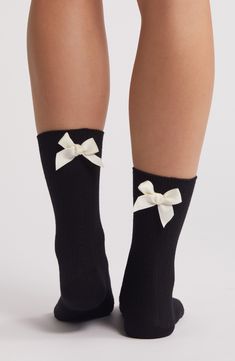 Ribbon bows sweeten these cotton-blend quarter socks designed to make a statement. Cotton/polyester Machine wash, tumble dry Imported Knit Slipper Socks, Bow Socks, Women Socks Fashion, Black And White Socks, Quarter Socks, Clara Bow, Knitted Slippers, Women Socks, Fashion Outfit Ideas