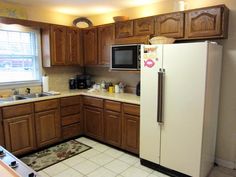 a white refrigerator freezer sitting inside of a kitchen