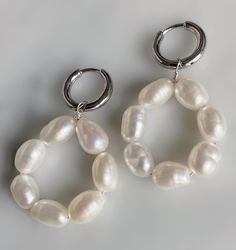 The dreamiest pearl hoops Details: Freshwater white baroque pearls Hoops are .925 sterling silver click hoops Sold as a pair Limited quantities Handmade in Los Angeles Measurements: Drop is approx. 1 inch from hoop Hoop is 12 mm Every item is made to order just for you. Please allow 5-10 business days for production time plus the time for shipping. Thank you and we can't wait to make your unique Drowning Bear piece! If you have any questions, please contact us : info@drowningbear.comSay hello to Hoop Pearl Earrings With Pearl Pendant, White Small Hoop Pearl Chain Jewelry, White Pearl Chain Small Hoop Jewelry, White Pearl Hoop Earrings With Pearl Charm, White Pearl Charm Hoop Earrings, Pearl White Hoop Earrings, Hoop Earrings With Pearl Pendant, White Hoop Earrings With Pearl Chain For Gift, White Hoop Earrings With Pearl Chain As Gift