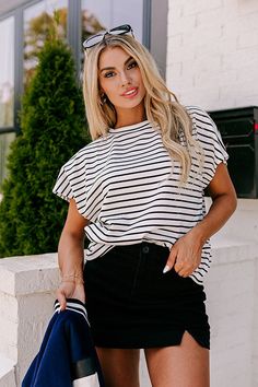 - Slay the day in stripes with this trendy top! - Unlined textured material with a striped pattern - A crew cut neckline - Short sleeves - A relaxed silhouette that ends in a straight hemline Slay The Day, Teacher Clothes, Crew Cut, Trendy Top, Crew Cuts, Trendy Tops, Leather Crossbody, Varsity Jacket, Short Sleeves