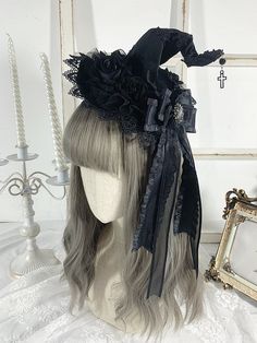 Complete your gothic Halloween look with our cross charm gothic black floral design witch hat. This stylish hat features intricate floral patterns, rhinestoned bowknot detailing, and a striking cross charm, adding a touch of mystique to your outfit. Made for the fashion-forward witch, this hat is the perfect accessory for any Halloween gathering or costume party. Stand out from the crowd and embrace your dark side with this bewitching accessory.   Please note that this product includes the hat o Black Fitted Witchy Hat, Fitted Black Witchy Hat, Gothic Black Mini Hats For Halloween, Witchy Black Top Hat For Halloween, Gothic Wide Brim Party Hat, Black Witchy Costume Hat With Short Brim, Black Gothic Hat For Costume, Black High Crown Hat For Halloween, Gothic Top Hat With Short Brim For Halloween