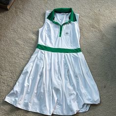 Lady Hagen White And Green Golf/Tennis Dress With Underlying Short. Slight Pleat To Skirt. Fits Larger, Like A Medium. May Fit A Large As Well. Unworn. New With Tag. Fitted White Tennis Dress With Short Sleeves, White Sporty Short Sleeve Tennis Dress, White Short Sleeve Tennis Dress, Sporty White Short Sleeve Tennis Dress, Sleeveless Green Tennis Dress For Spring, White Cotton Tennis Skirt, White Preppy Tennis Dress For Spring, Preppy Fitted White Dress, Preppy Tennis Dress For Spring