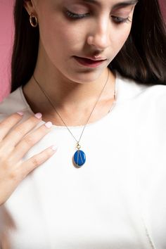 Monica Rich Kosann blue enamel vermeil oval locket necklace. What's your story? Tell it in color. Give your story style with our Blue Enamel Gold Vermeil Oval Locket. Perfect on its own or layered with your other favorite pieces. Locket holds two images. Locket Measures 15/16" Tall by 11/16" Wide. 17" Black Steel Chain, with a loop at 16" for adjustability and a complimentary 18" Blue Cord to create a second look. 18k Yellow Gold Vermeil over Sterling Silver Yellow Gold Enamel Oval Pendant Jewelry, Yellow Gold Enamel Oval Pendant Necklaces, Blue Enamel Locket Jewelry, Blue Oval Enamel Necklace, Blue Hallmarked Medallion Jewelry, Yellow Gold Enamel Oval Jewelry, Oval Yellow Gold Enamel Jewelry, Oval Enamel Locket Jewelry, Blue Medallion Jewelry With Polished Finish