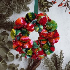 a christmas wreath is hanging on the wall