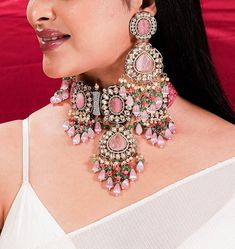 Pink Polki Necklace Sabyasachi Jewelry Set, inspired by Victorian designs from India. The Kundan Jewelry and Victorian Polki Choker showcase intricate craftsmanship. This exquisite ensemble exudes opulence and elegance, reflecting the timeless allure of Indian jewelry. Celebrate any special occasion with this captivating Kundan Choker, a perfect blend of tradition and luxury, making you shine like a true queen. *𝐏𝐑𝐎𝐃𝐔𝐂𝐓 𝐃𝐄𝐓𝐀𝐈𝐋* * Material: Brass * Plating: Gold Plated * Stone: Semi Traditional Luxury Kundan Choker Necklace, Luxury Pink Kundan Necklace In Elegant Style, Polki Choker, Indian Choker, Kundan Jewellery Bridal, Jewelry Kundan, Sabyasachi Jewellery, Jewelry Victorian, Kundan Choker