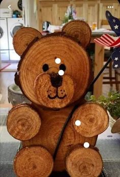 a teddy bear made out of wood with buttons on it