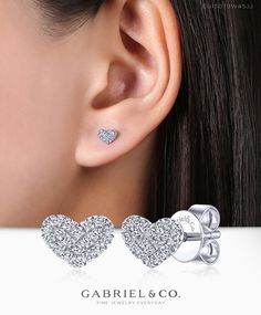 Carry love with you always when you wear these luminous heart shaped diamond earrings. Brilliant 0.11ct pavé diamonds completely encrust each 14k white gold piece. These simple yet meaningful heart earrings are an ideal gift for the one you love.  EG13079W45JJ #Earrings #FashionEarrings #FineJewelry#FashionJewelry#UniqueJewelry#GiftIdeas#UniqueGifts  #DiamondJewelry #Jewelry  #GabrielNY #DiamondJewelry #FineJewelry #GabrielAndCo #UniqueJewelry Luxury Brilliant Cut Heart Earrings For Valentine's Day, Luxury Heart-shaped Diamond Earrings For Wedding, White Gold Heart Charm Earrings For Wedding, Wedding White Gold Earrings With Heart Charm, Valentine's Day Fine Jewelry White Gold Earrings, Valentine's Day White Gold Fine Jewelry Earrings, Luxury Diamond Heart Earrings For Valentine's Day, Fine Jewelry Heart Earrings With Heart Charm For Wedding, Fine Jewelry Heart Charm Earrings For Wedding