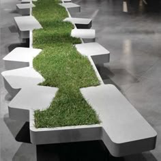 an artistic bench with grass growing out of it