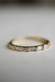 Straight Baguettes Band | 1.20 TW Baguette Colorless Moissanite | 3/4 Eternity Band | Wedding Band | Engagement Ring | 14KT White Gold Band Shape: Baguette Cut * Weight: 1.20 CTW * Color: Colorless * Clarity: VVS * Measurements: 4.00 x 2.00 x 1.20 MM * Make: Excellent ❁❁ 𝐉𝐞𝐰𝐞𝐥𝐫𝐲 𝐂𝐞𝐫𝐭𝐢𝐟𝐢𝐜𝐚𝐭𝐞 ❁❁ ↣ OdettArt Jewels branded authenticate Jewelry Certificate comes with the authenticity of Metal, Moissanite, and Gemstone combination. ↣ The certificate comes with Limited Lifetime Warran Gold Baguette Wedding Band, Wedding Band Baguette, Eternity Engagement Band, Baguette Eternity Band, Wedding Band Engagement Ring, Promise Band, Half Eternity Wedding Band