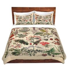 an image of a bed set with flowers on the comforter and pillowcases