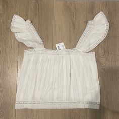 Intermix Beachclub Tamara Ruffled Cotton Top Color: White Size: P Condition: Nwt Summer Tops With Lace Trim And Ruffled Straps, Breezy Summer Tops With Ruffles, Summer Breezy Ruffled Tops, Breezy Ruffled Tops For Summer, Feminine Ruffled Tops For Vacation, Summer Beach Tops With Ruffled Straps, Sleeveless Ruffled Beachwear Top, Sleeveless Ruffle Tops For Beach Season, Summer Tops With Ruffled Straps For Beach