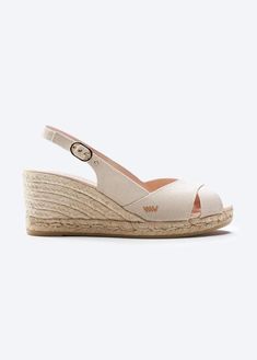 These stylish and flirty Llansa canvas wedges have a flattering slingback heel, an elegant buckle and soft cotton, 100% organic canvas for a comfortable, luxurious fit. And with a gorgeous 2 ½” heel, they’re comfortable enough to get you from sunny days to stylish nights. TOP TIP: STYLING Sexy and stylish, these handmade espadrille wedges feature eco-friendly jute soles for natural breathability, the perfect party shoes for those hot summer evenings. Medium Wedges, Sandal Wedges, Comfortable Wedges, Wedge Espadrilles, Espadrille Sandals, Unisex Shoes, Slingback Heel, Unisex Accessories, Womens Wedges