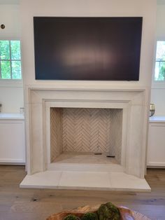 a fireplace with a tv above it in a living room