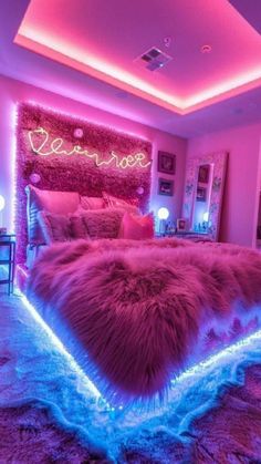 a bedroom with pink and blue lights on the walls, fur rugs and bedding