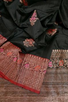 This latest collection is in a black and red color combination, a pure tussar silk banarasi saree with golden zari and meenakari work, and in an alluring meenar butta work on the body and traditional meenakari work on the pallu and the border and all over. Color: A shade of black and red color Technique: A pure and refined hand-done work of border with meenakari zari work and traditional meena butta work Fabric: Tussar Quality: IndyVogue's Assurance of Silk Mark Certification Note: Comes with co All Over Color, Red Color Combinations, Tussar Saree, How To Wash Silk, Silk Banarasi Saree, Brocade Blouses, Blouse Measurement, Color Techniques, Banarasi Saree