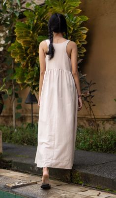 This beautiful dress, made of a linen textured cotton, is great to throw on over a bathing suit, to go shopping or out to dinner. With its wide flowing skirt feel free to do ballet, and it has pockets. It was made with care in our fair trade, in-house workshop in Bali. Hand or machine wash cold, tumble dry on low heat or line dry. Andrea & Lucy design each of our relaxed, versatile pieces to be part of a classic, timeless, minimalist wardrobe.100% Cotton - Hand or machine wash warm, tumble dry l Cotton Maxi Dress With Relaxed Fit, Unlined, Relaxed Fit Cotton Maxi Dress Unlined, Flowy Linen Dresses, Unlined, Flowy Linen Dresses Unlined, Beige Cotton Midi Dress For Beach, Flowy Linen Maxi Dress For Daywear, Breezy Cotton Maxi Dress, Flowy Linen Sundress For Daywear, Beige Cotton Linen Dress For Vacation