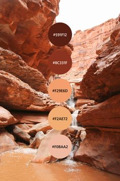 some rocks and water in the middle of a canyon with different color names on them