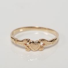 Thanks for shopping our vintage estate store. We tend to sell well below wholesale and truly hope you enjoy all of our items. Many of the items are one of a kind, so please enjoy scrolling through the pictures and hopefully something will catch your eye. Brown spots are from camera or reflections. Estate 14k yellow gold heart baby ring. Custom made ring for our shop. Ring size: 1.5 sizing fee $10 Setting: 3mm Band width: 1mm Weight: .43 gram Marked 14k and it's sweet. One that you will love. Only Gold Ring, Gold Ring Heart, Vintage Gold Ring, Antique Gold Rings, Baby Ring, Baby Heart, Heart Rings, Antique Style Rings, Vintage Gold Rings