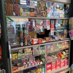 a store filled with lots of different types of candy and confection items on display