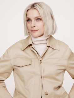 An ode to 90s minimalism, we pared back the utilitarian detailing for this short jacket, opting for a concealed button placket and welt pockets at the front.  We cut this one in a beautiful stretch-cotton sateen fabric, one we love for its dressed-up appearance.  Warm: Unlined.  Relaxed fit.  Point collar with concealed button front.  Side seam and single chest pockets.  Unlined.  Relaxed fit.  Long sleeves.  Hip length.  Model: Size S, 5'10" (178cm). Fitted Collared Utility Jacket With Flap Pockets, Fitted Utility Jacket With Flap Pockets And Collared Shape, Utility Style Cropped Jacket With Flap Pockets, Utility Cropped Jacket With Flap Pockets, Classic Utility Jacket With Buttoned Pockets For Spring, Fall Workwear Cropped Jacket With Patch Pockets, Fitted Cropped Jacket With Patch Pockets For Fall, Fall Cropped Jacket With Patch Pockets For Work, Chic Collared Utility Jacket With Flap Pockets