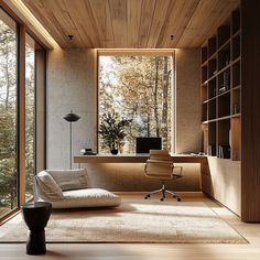 a modern home office with wood paneling and glass doors that open to the outdoors