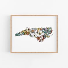 an art print with flowers in the shape of a map