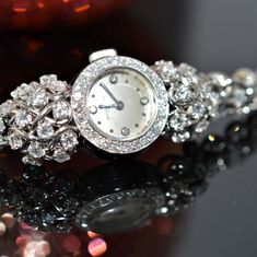 A ladies platinum and diamond 7 inch long wristwatch by Vacheron and Constantin.  The wind watch has a swiss movement with 17 jewels and is adjusted to temperature.  There are 134 round diamonds having a total approximate weight of 4.68 carats. The watch has been fully cleaned and serviced and is in working order. Judith Leiber Couture, Vacheron Constantin, Rose Gold Morganite, Diamond Anniversary Rings, Diamond Anniversary, White Dial, Bezel Diamond, Morganite, Birthstone Jewelry