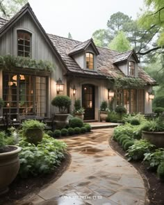 a house that is surrounded by plants and trees