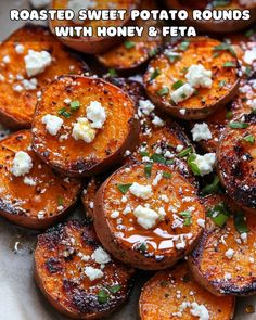 roasted sweet potato rounds with honey and feta on a white plate topped with parsley