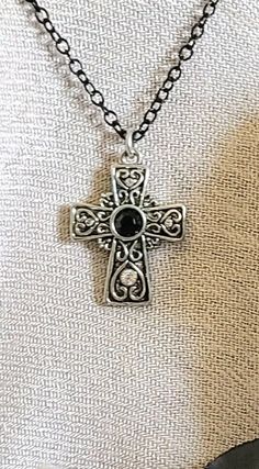 "NECKLACE: Celtic Scroll Cross Necklace with Black and Clear Quartz Crystal Gemstone and Black Inlays.  18\"  Black Steel Chain with Lobster Clasp and 3\" Extension.  Great gift for yourself or someone you Love!❤ SIZE: Charm  L 1\" x W 3/4\" SHIPPING: FREE!❤ ❤Arrives Beautifully Packaged❤ Feels like a gift when opened or is Ready to be gifted, just wrap the box when you receive it.❤ ALL HANDMADE by London Joelle in Loveland, OH Thank you for shopping at Mystika!  Be sure to check out my entire s Black Pendant Cross Necklace As Gift, Black Cross Pendant Necklace As Gift, Black Pendant Cross Necklace Gift, Black Metal Cross Necklace As Gift, Elegant Black Cross Necklace Gift, Black Cross Pendant Necklace For Gift, Black Spiritual Charm Necklace As Gift, Black Spiritual Charm Necklace For Gift, Gothic Cross Jewelry As Gift