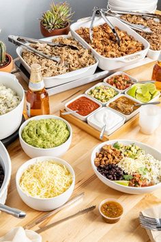 a table filled with lots of different types of food and condiments on it