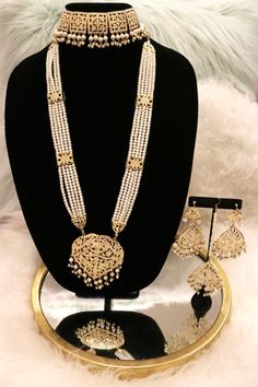 Handcrafted with love to give a real traditional look for this set beautifully studded with jadau stones and pearls give a royal look. Includes: Choker, Rani Haar, Earrings, and Tikka Rampuri Jewellery Set, Rani Set Gold, Jadau Rani Haar, Rani Haar Gold Design, Traditional Kundan Pearl Drop Necklace, Bollywood Kundan Necklace With Pearl Drop, Bollywood Style Kundan Necklace With Pearl Drop, Pearl Drop Kundan Necklace For Diwali, Diwali Pearl Drop Kundan Necklace