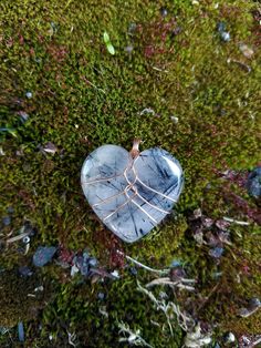 "Handmade copper wire wrapped Black Rutilated Quartz crystal heart pendant necklace. This black rutilated quartz crystal heart is wrapped in a minimalist style with bare copper wire. I love this style for it's simplicity and humanistic design as it depicts a heart inside a rib cage. This is the perfect gift to show love and appreciation to a loved one or yourself! You can choose between four different chain or cord options - 1 mm cotton cord, 2 mm cotton cord, 1 mm \"dainty\" chain, 1.7 mm \"bold\" chain. Both chain options are made from tarnish resistant copper. Both cotton cord options come with a very generous length to be knotted or finished as you like! Please be mindful that bare copper wire will start to show patina and tarnish over time. The aging of copper wire can be either beaut Heart Shaped Crystal Wire Wrap, Heart Shaped Wire Wrapped Pendant, Wire Rock Jewelry, Heart Wire Wrap, Wire Wrapped Heart Stone, Wire Wrapped Rocks, Easy Wire Wrapping Stones, Simple Wire Wrapped Pendant, Wrapped Crystal Point