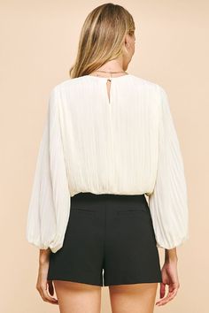 The Deserae Pleated Blouse is perfect for the office, date night or even a holiday gathering. Features an elegant bishop sleeve and gathered waist so it's easy to style and wear. Classy while being sophisticated - our favorite combination! Pleated Fabric Bishop Sleeves Gathered waistline (falls at waist) Round Neck Keyhole button back 100% Polyester Pleated Top, Pleat Top, Linens And Lace, Pleated Blouse, Pleated Fabric, Bishop Sleeve, Blazer With Jeans, Woven Top, Handbag Shoes