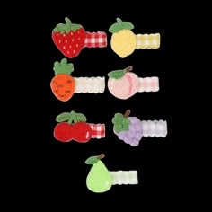 an assortment of fruit and vegetable hair clips